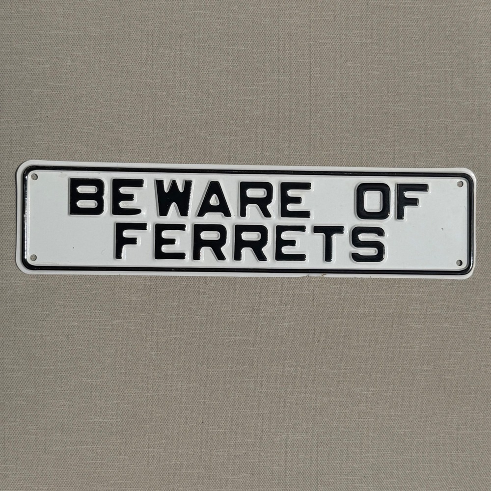 Beware of Ferrets Embossed Metal Novelty Sign White Black 12x3 Inch